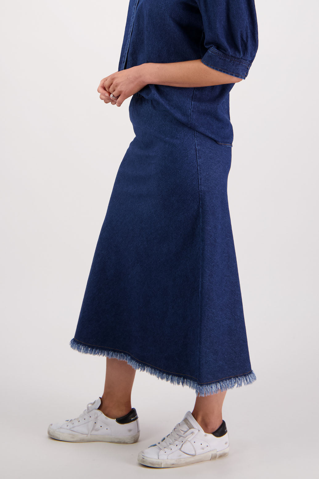 Womens denim skirt with raw hem, bias cut and elasticated waist. Briarwood NZ