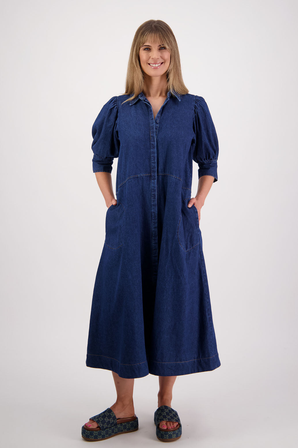 Womens denim dress with curved waist and slight puff below the elbow sleeves.Briarwood NZ. Steffie 