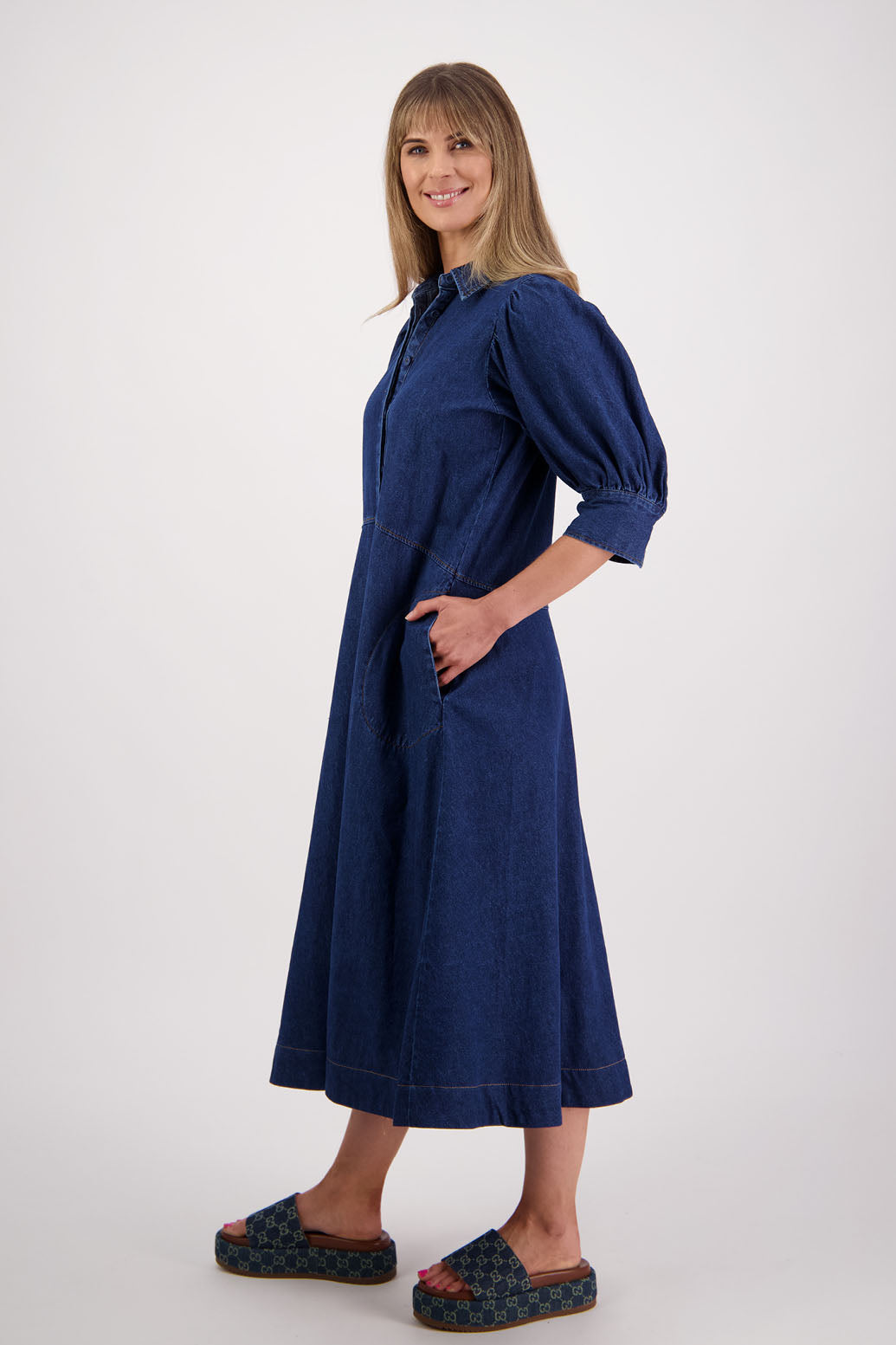 Womens denim dress with curved waist and slight puff below the elbow sleeves.Briarwood NZ. Steffie 