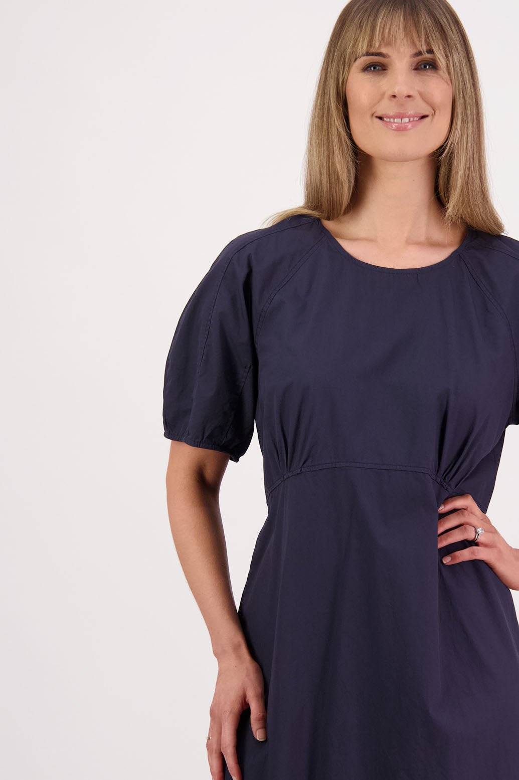 Womens Ink/Navy cotton poplin dress with slight puff sleeves and empire line bodice. Briarwood NZ. Steph