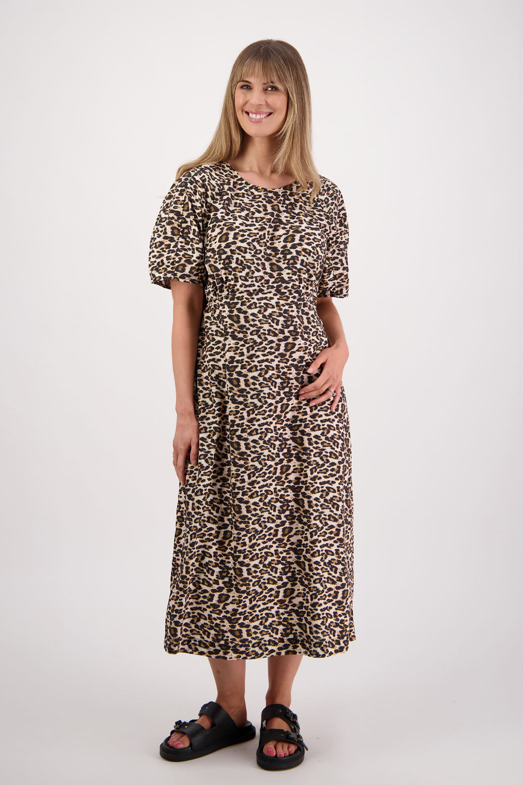 Womens Leopard print cotton poplin dress with slight puff sleeves and empire line bodice. Briarwood NZ. Steph