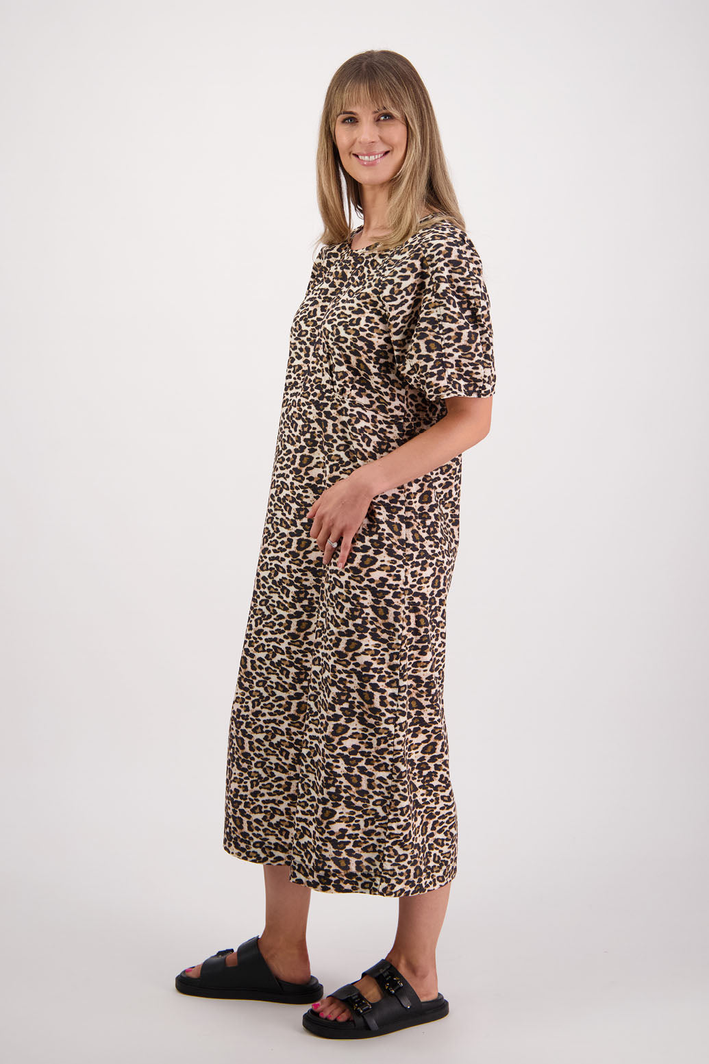 Womens Leopard print cotton poplin dress with slight puff sleeves and empire line bodice. Briarwood NZ. Steph
