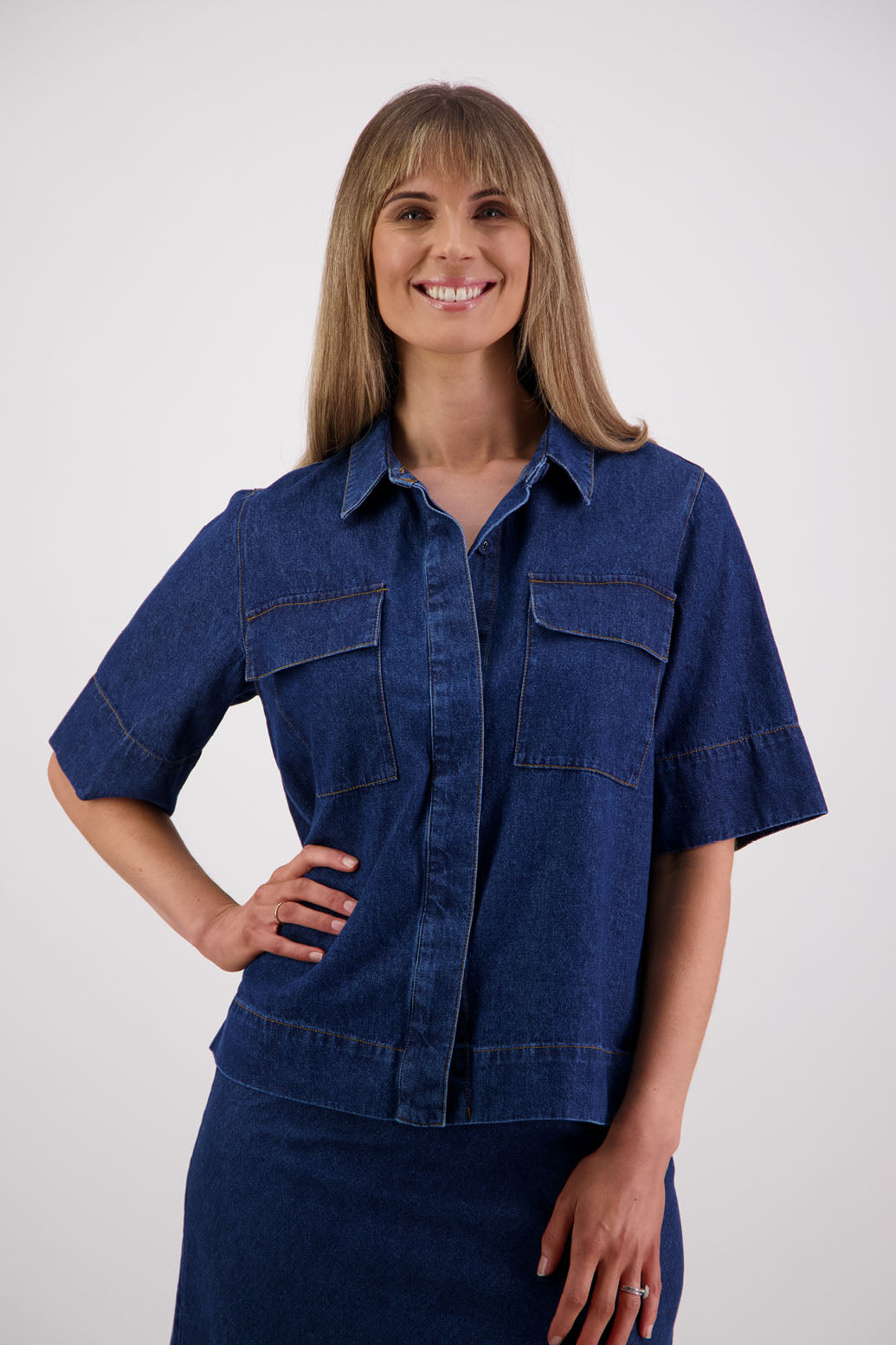 Womens box fit denim shirt with covered buttons, stitched on pockets and covered placket. Briarwood NZ. Syd