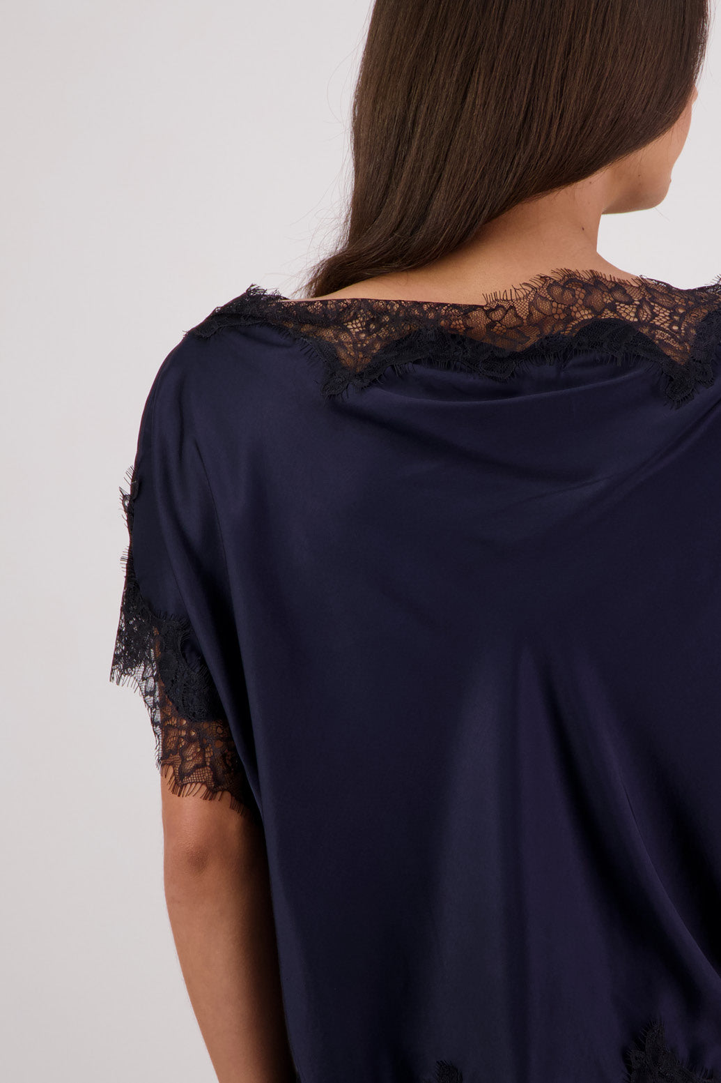 Closeup back view Briarwood Tabby Top in ink, 100% viscose with black lace trims.