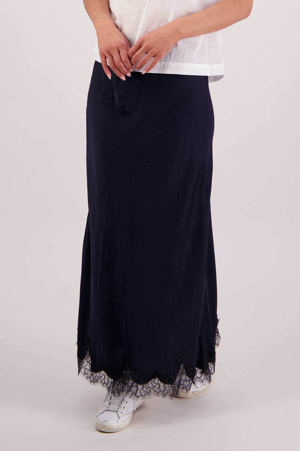 Close up front view Briarwood Tallulah skirt in ink with black lace trim.