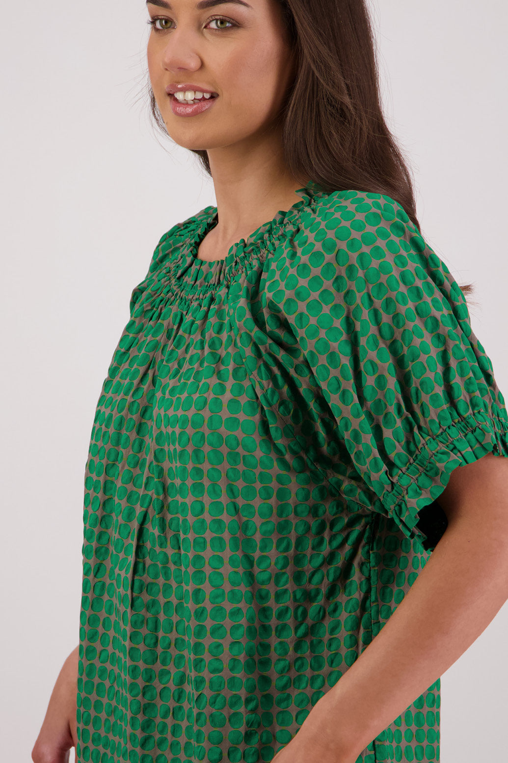 Coseup side view Briarwood Tammy Top in Grey/Green print.