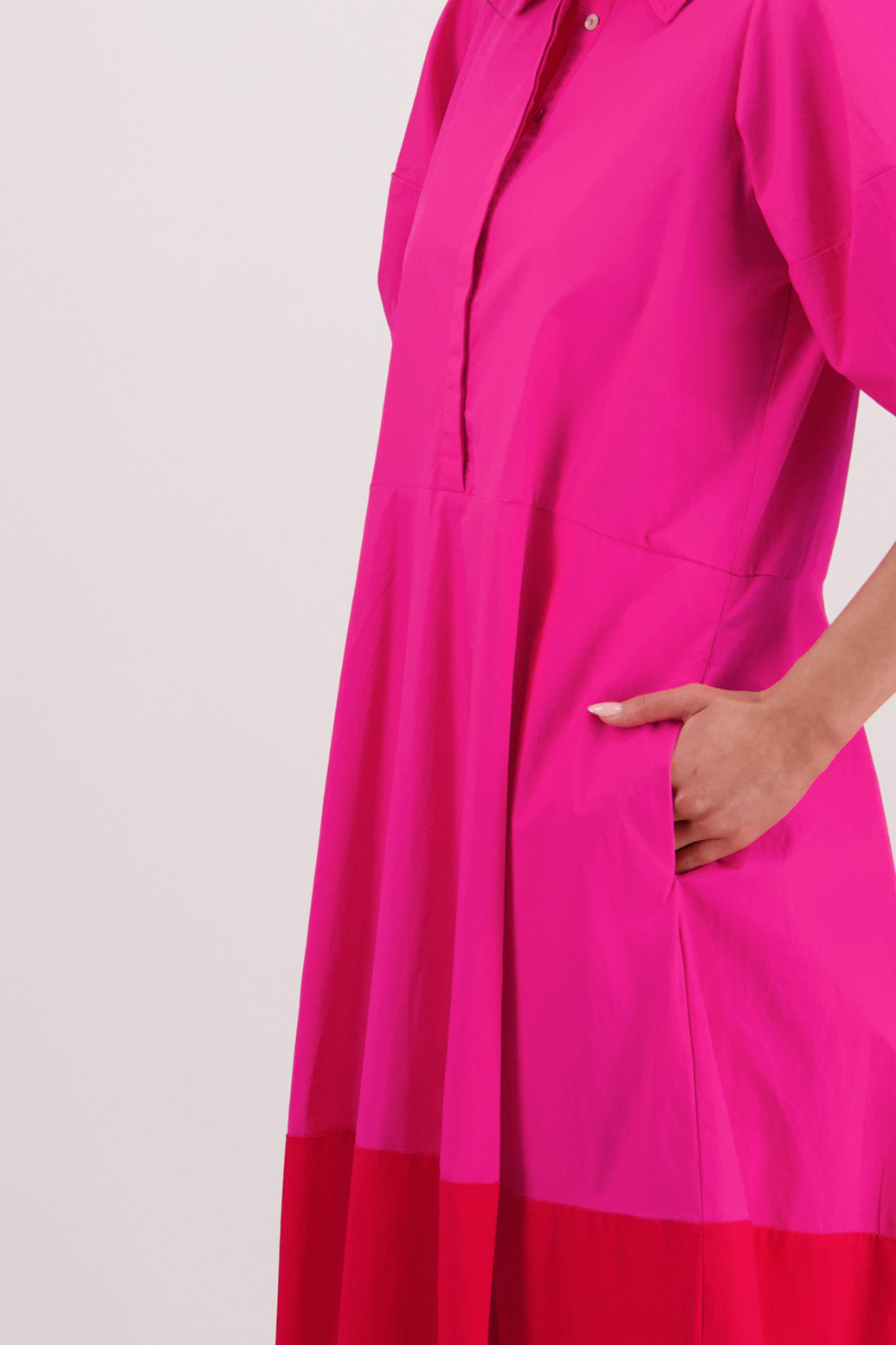 Closeup side of two-tone view Briarwood Tamsin Dress in Pink & Red.