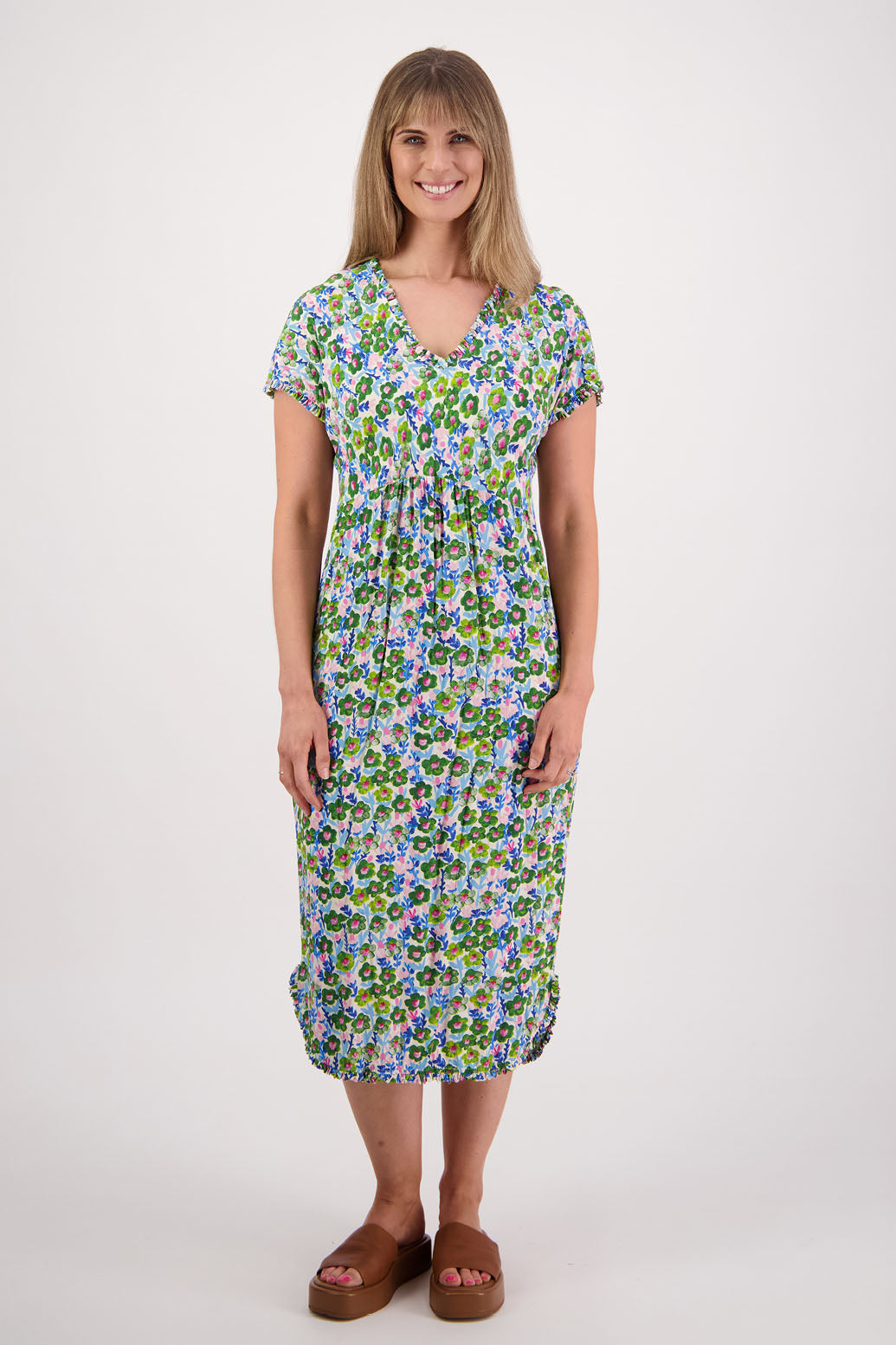 Womens midi dress with bias cut bust and v neck, straight skirt, shaped hem and ruffles around neck, sleeves and hem. Briarwood NZ. Viscose. Taylor. Daisy print