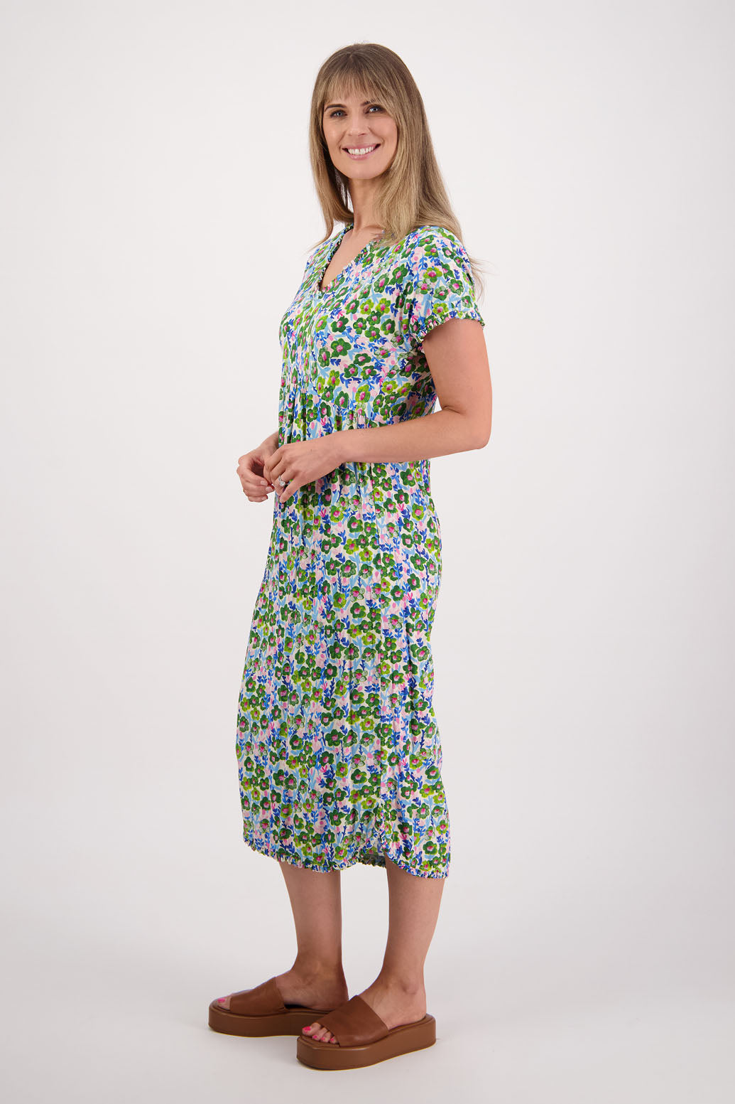 Womens midi dress with bias cut bust and v neck, straight skirt, shaped hem and ruffles around neck, sleeves and hem. Briarwood NZ. Viscose. Taylor. Daisy print