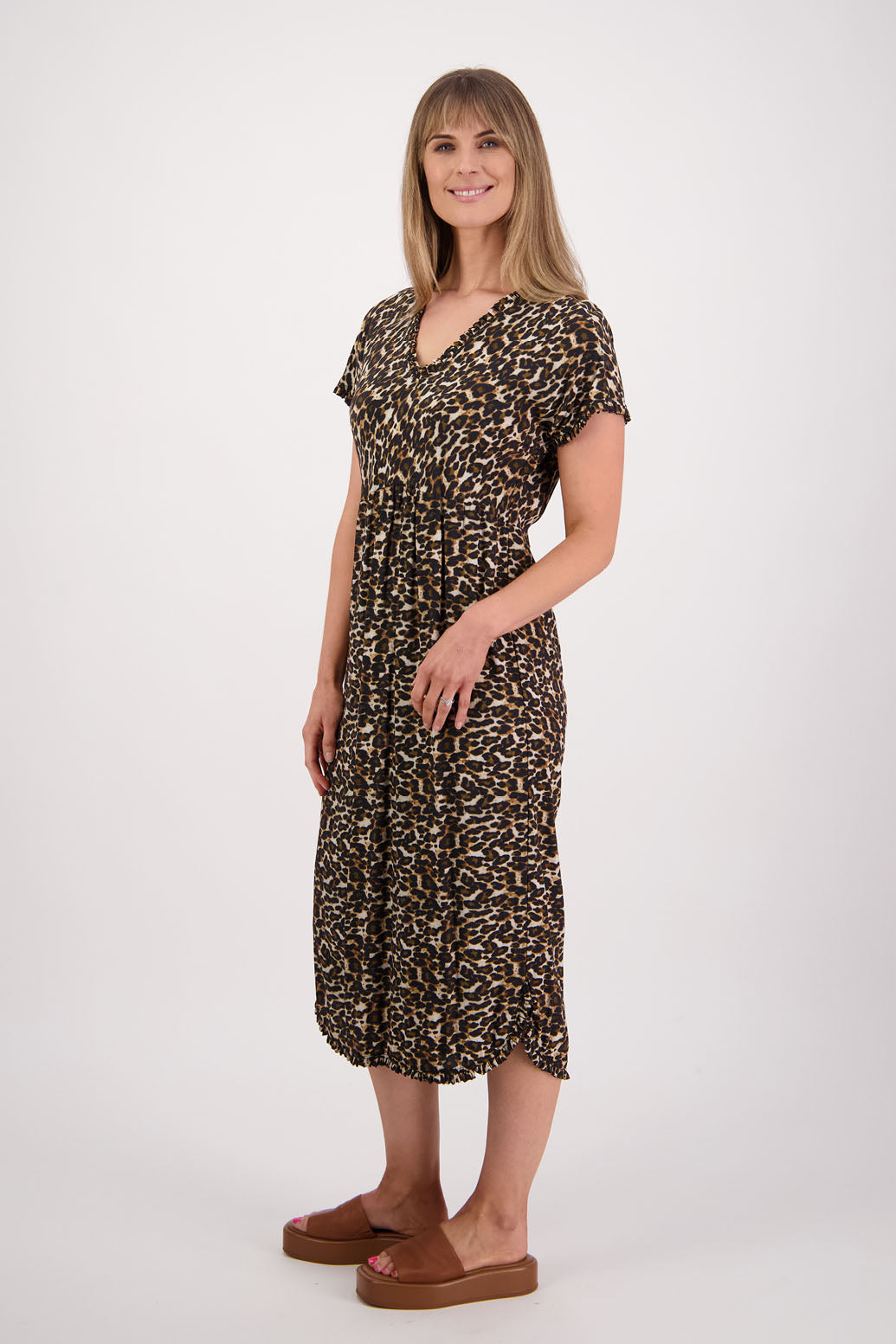Womens midi dress with bias cut bust and v neck, straight skirt, shaped hem and ruffles around neck, sleeves and hem. Briarwood NZ. Viscose. Taylor. Leopard print