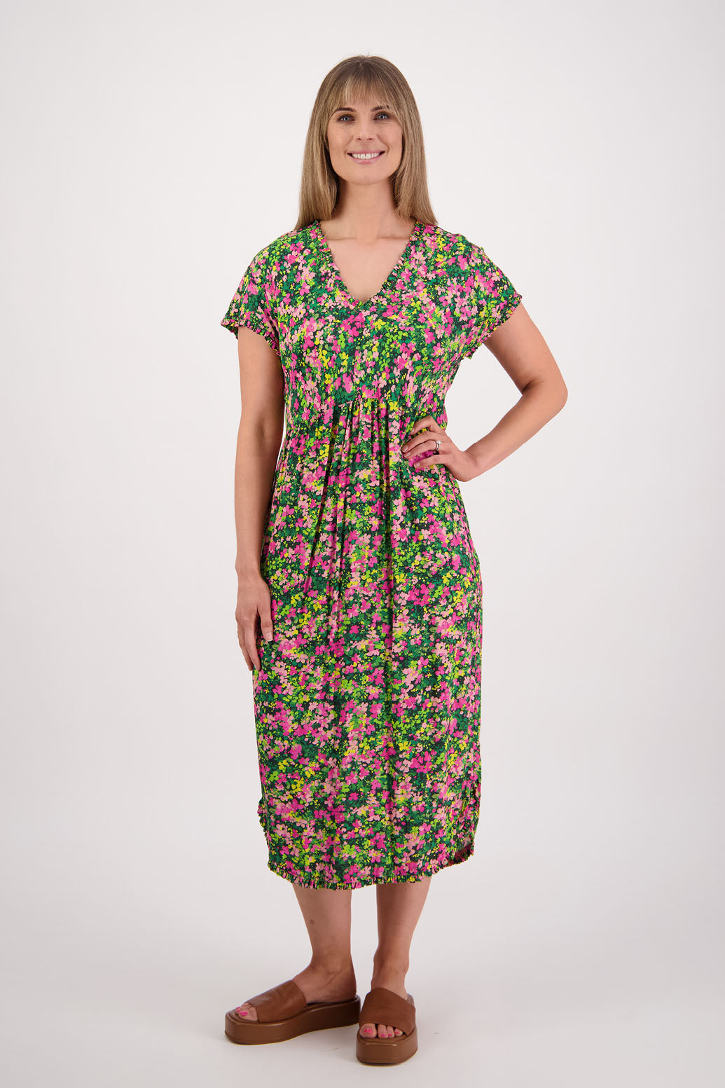 Womens midi dress with bias cut bust and v neck, straight skirt, shaped hem and ruffles around neck, sleeves and hem. Briarwood NZ. Viscose. Taylor. Pansy print