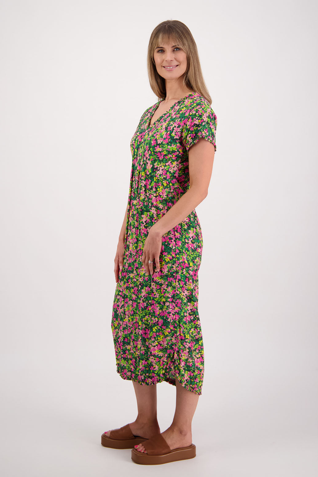 Womens midi dress with bias cut bust and v neck, straight skirt, shaped hem and ruffles around neck, sleeves and hem. Briarwood NZ. Viscose. Taylor. Pansy print