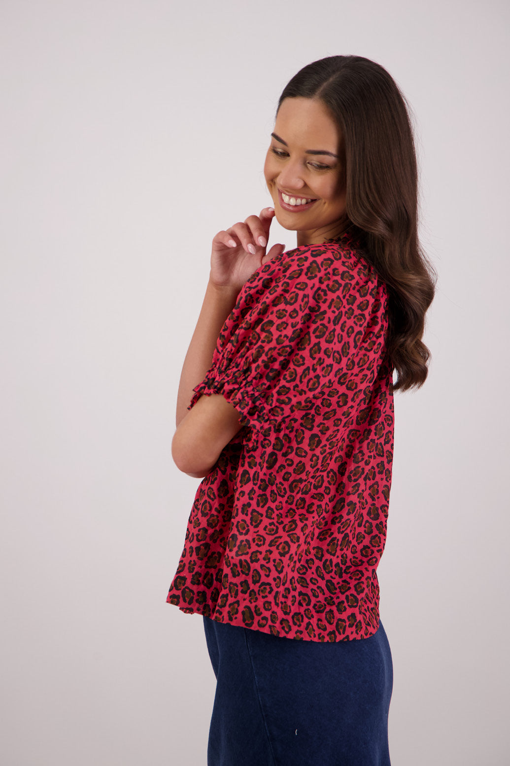 Side view of Briarwood Teddy Top in red animal print.