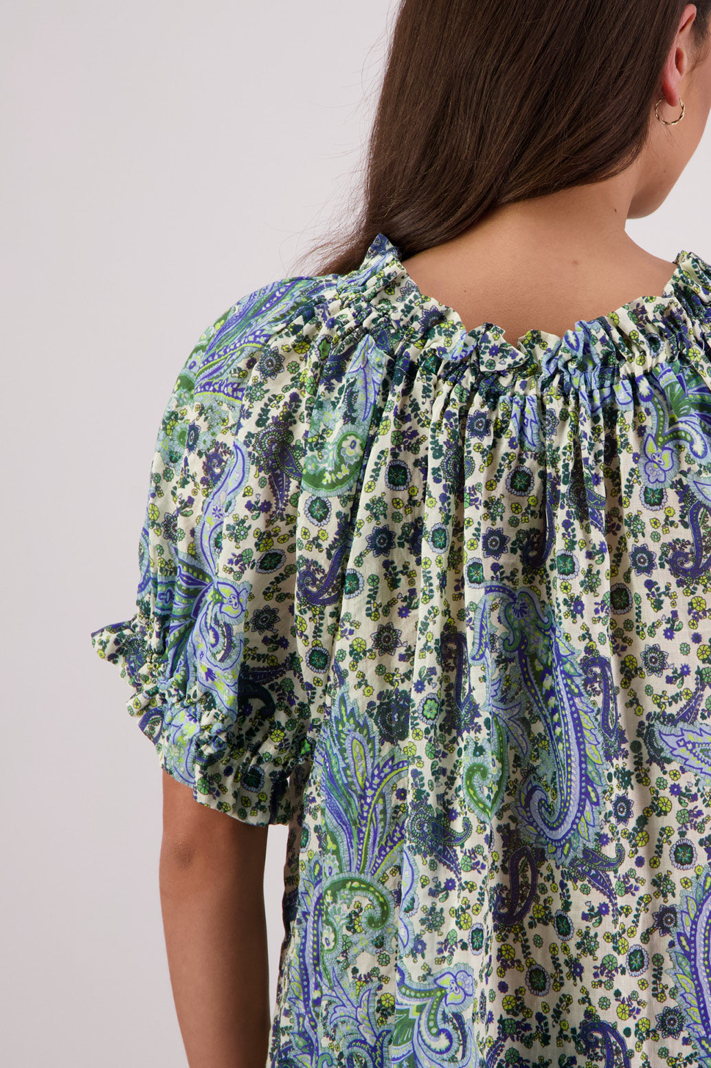 Close up of back view of Briarwood Teddy Top in blue paisley print.