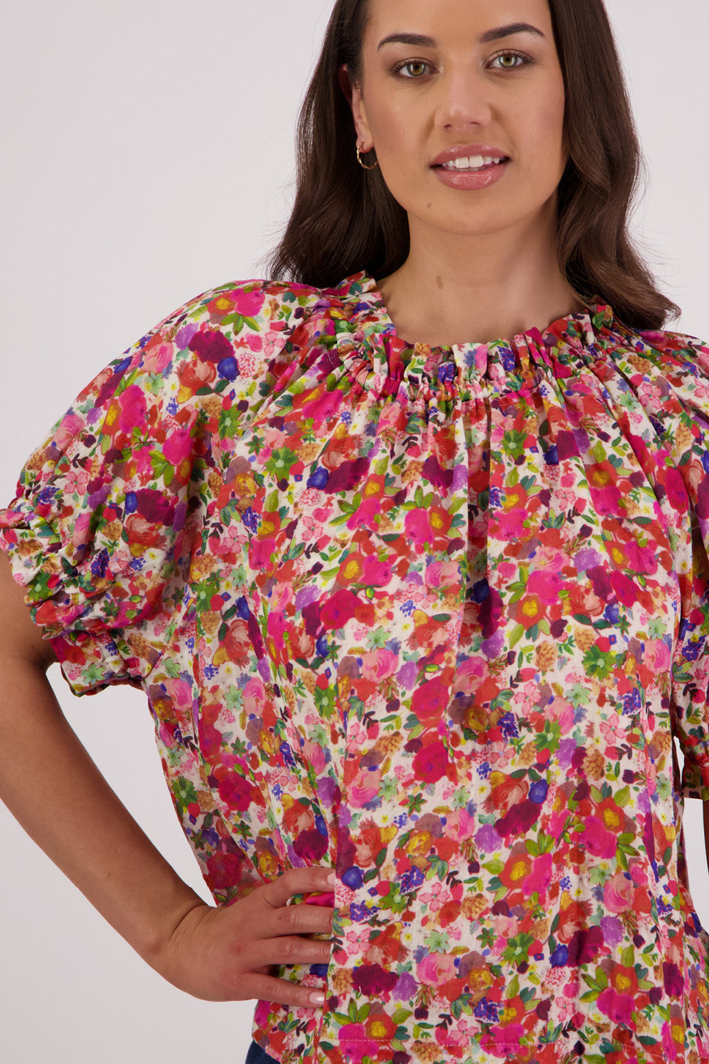 Close up of front view of Briarwood Teddy Top in bright floral print.