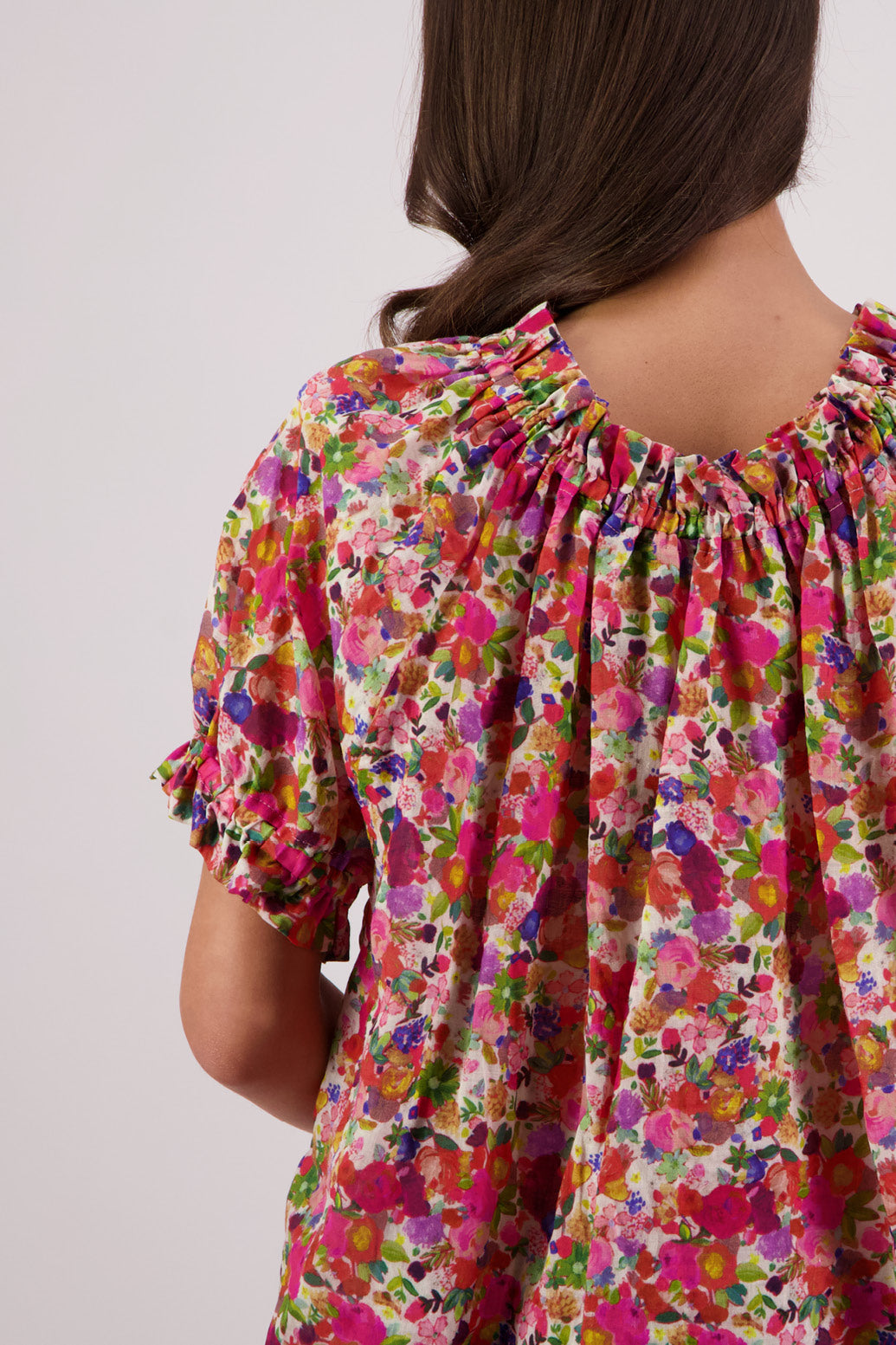 Close up of back view of Briarwood Teddy Top in bright floral print.