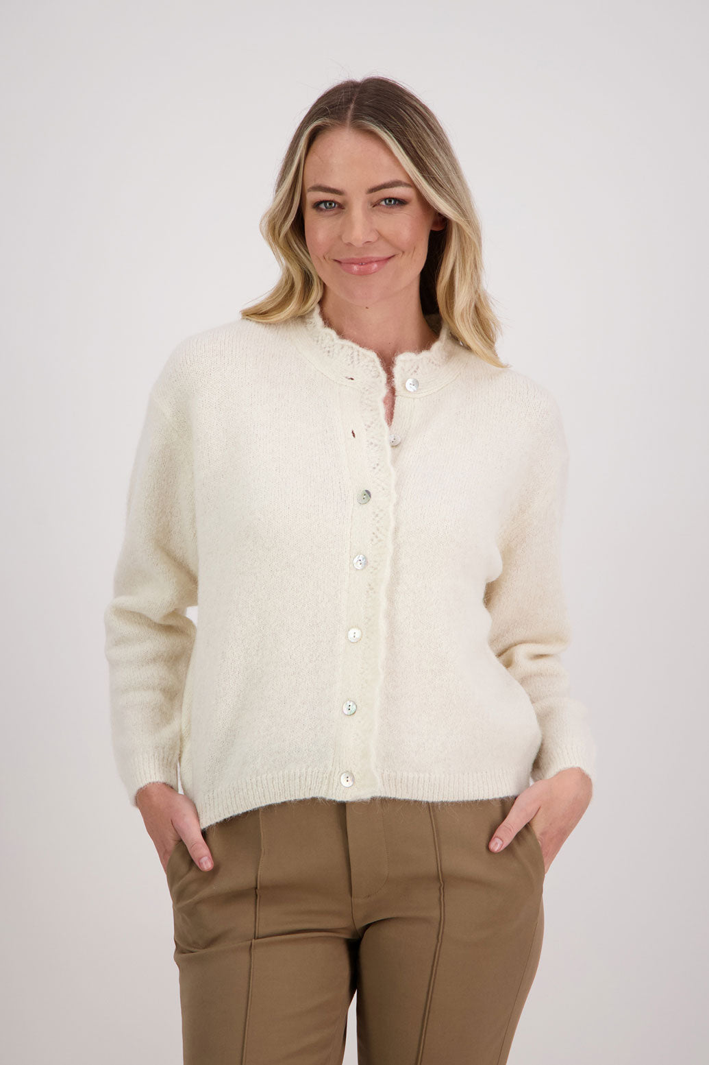 Ivory/Cream Briarwood cardigan with knitted lace trim around the neck and down the buttons.