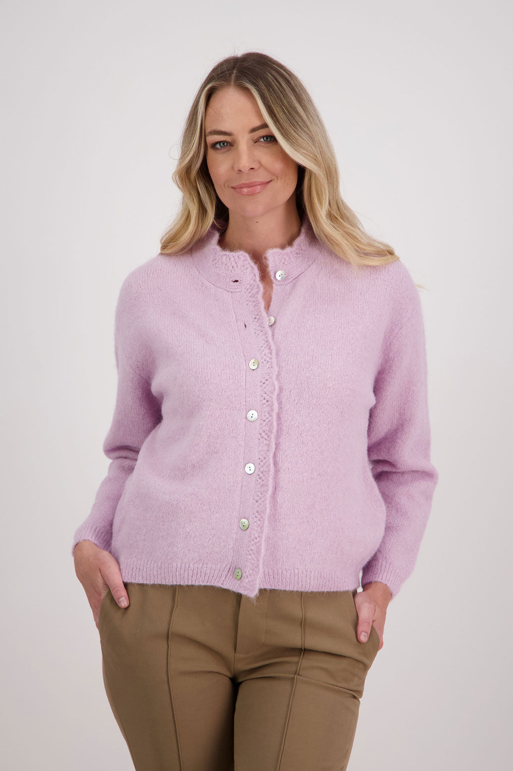 Pink/Mauve Briarwood cardigan with knitted lace trim around the neck and down the buttons.