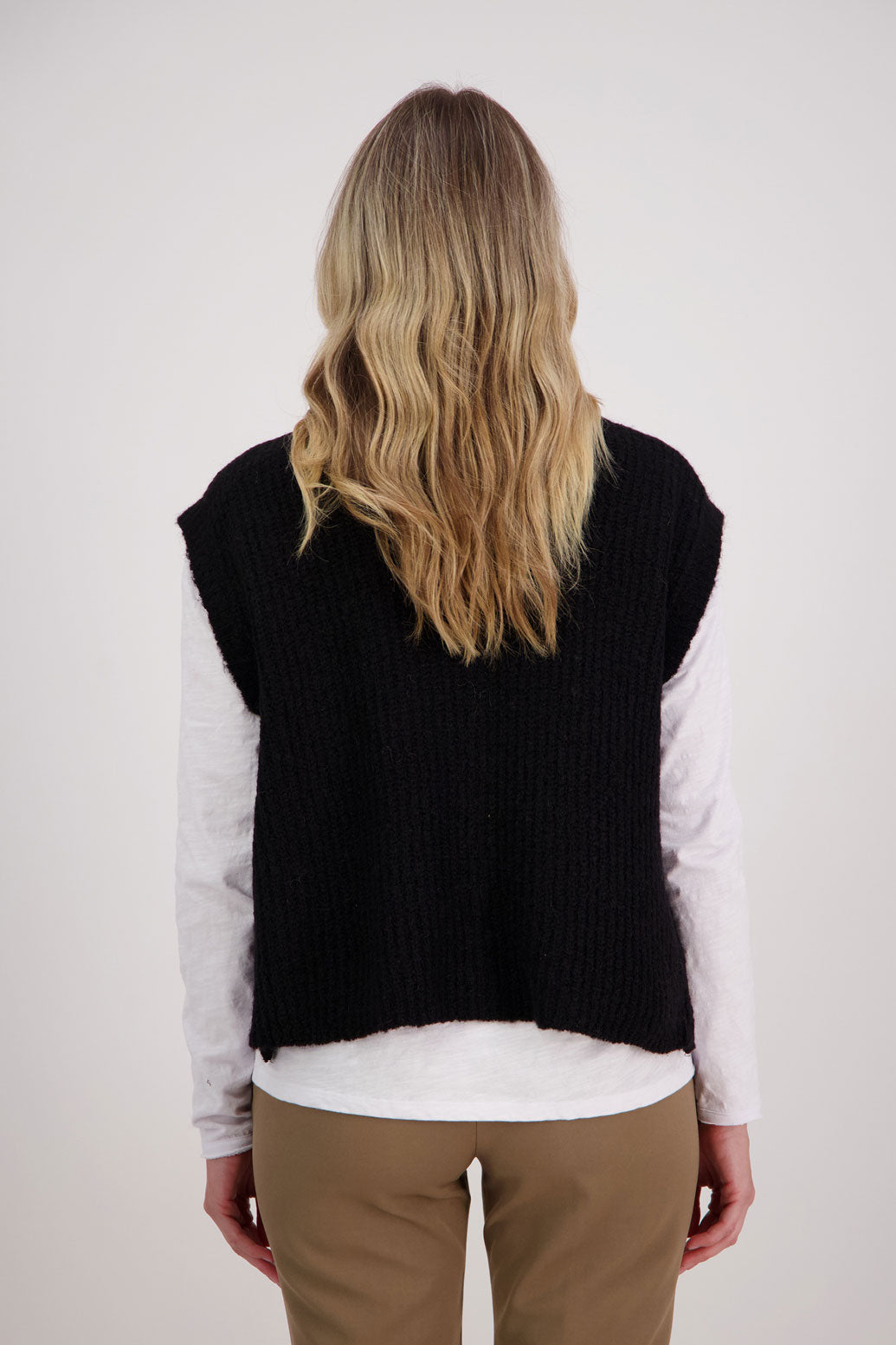 Black sleeveless Mohair/Wool Blend knit vest. High neck and side zip. Vickie