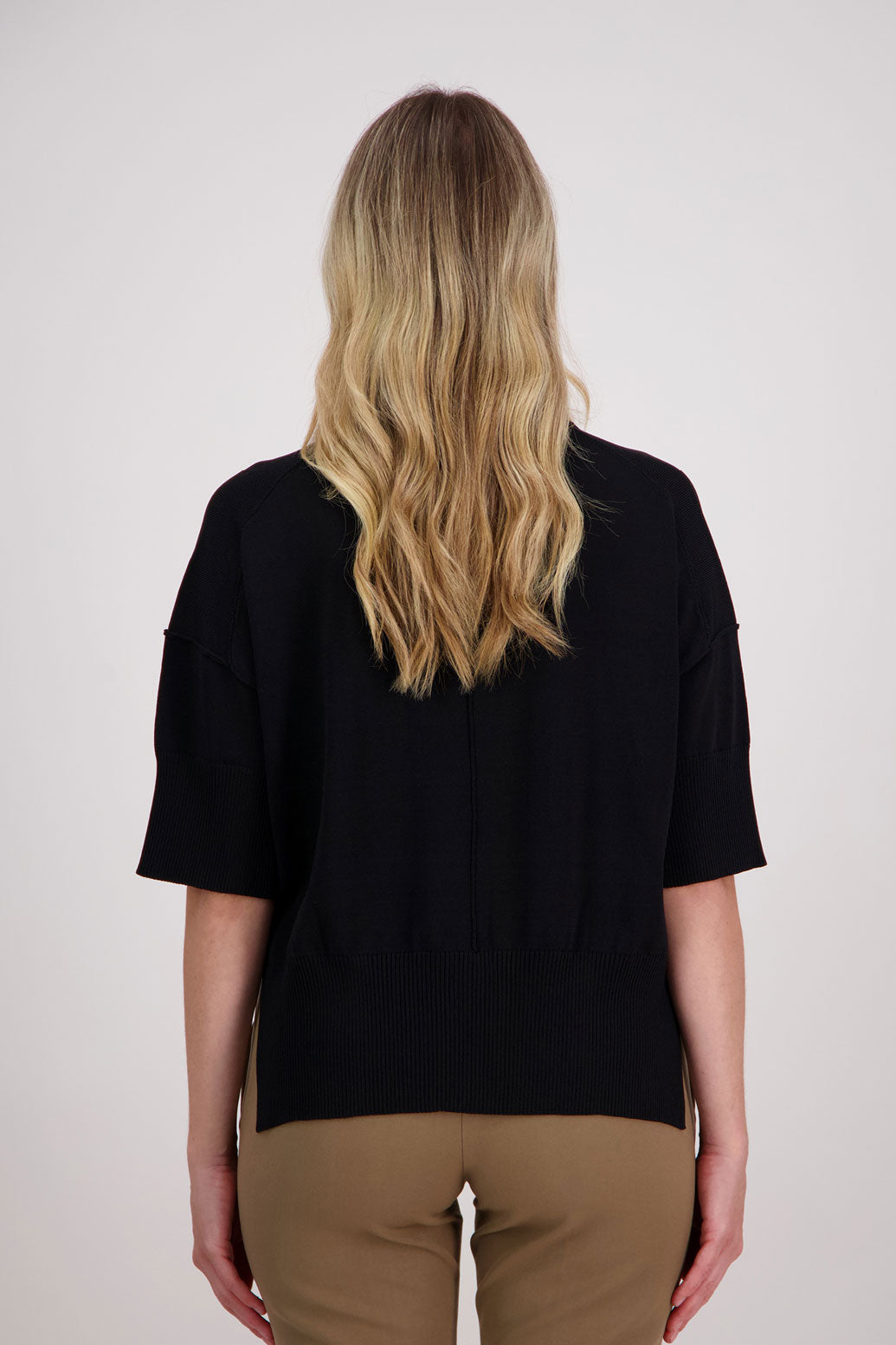 Vinnie black knit top. 3/4 Sleeves, drop shoulder and wide hem with split