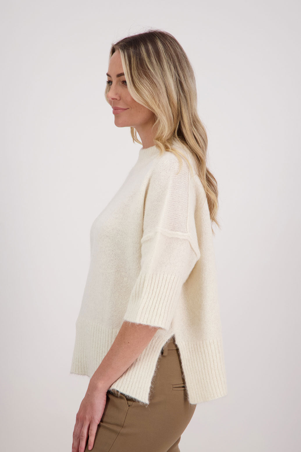 Ivory/White Alpaca/Wool blend top with elbow length sleeves and drop shoulder. Virginia